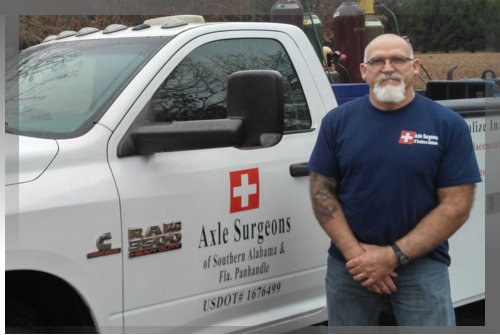 Howard Crowe, owner of Axle Surgeons Of Southern AL & FL Panhandle, beside his mobile service truck