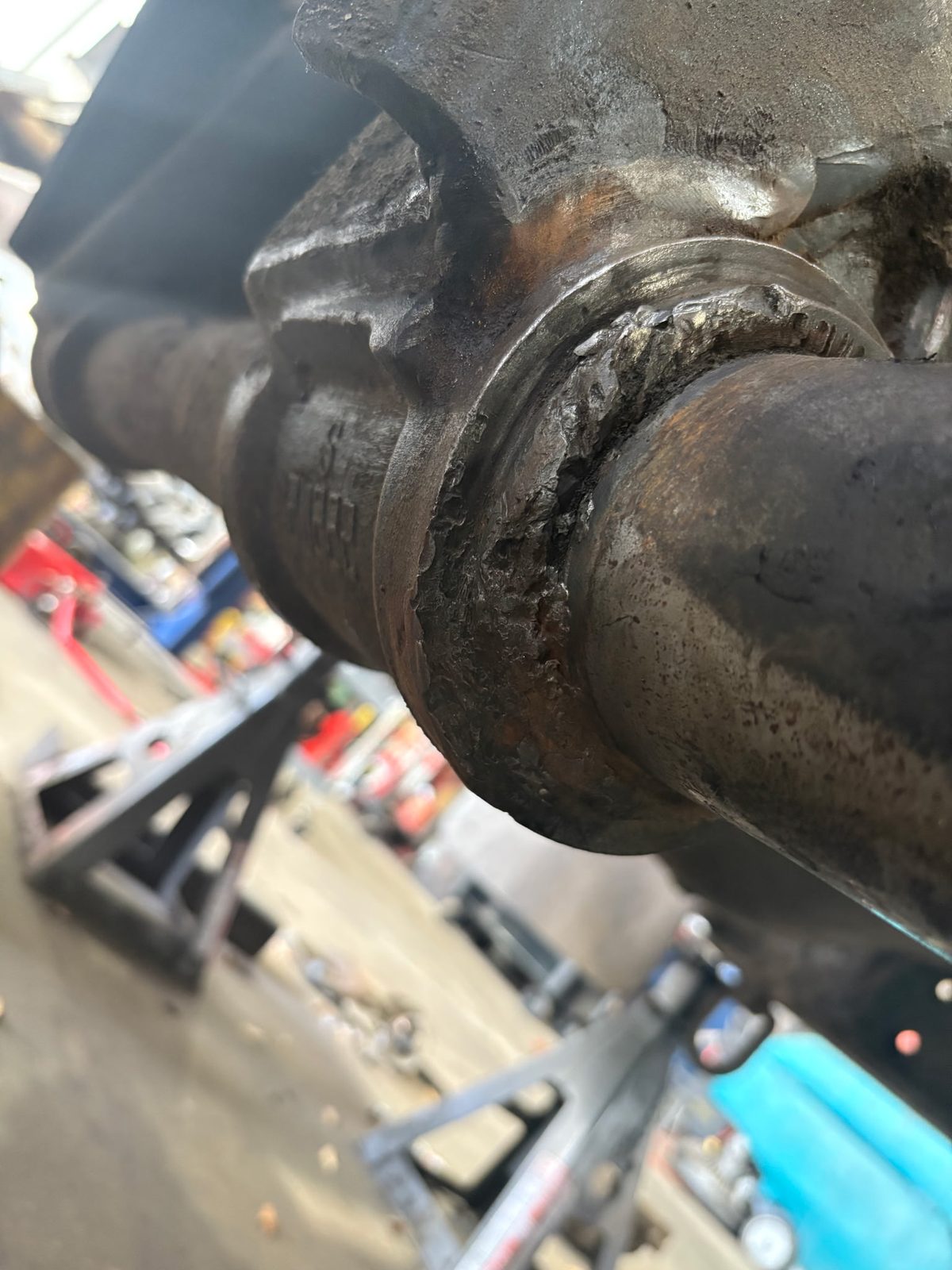 Close-up of a damaged Mack trunnion shaft