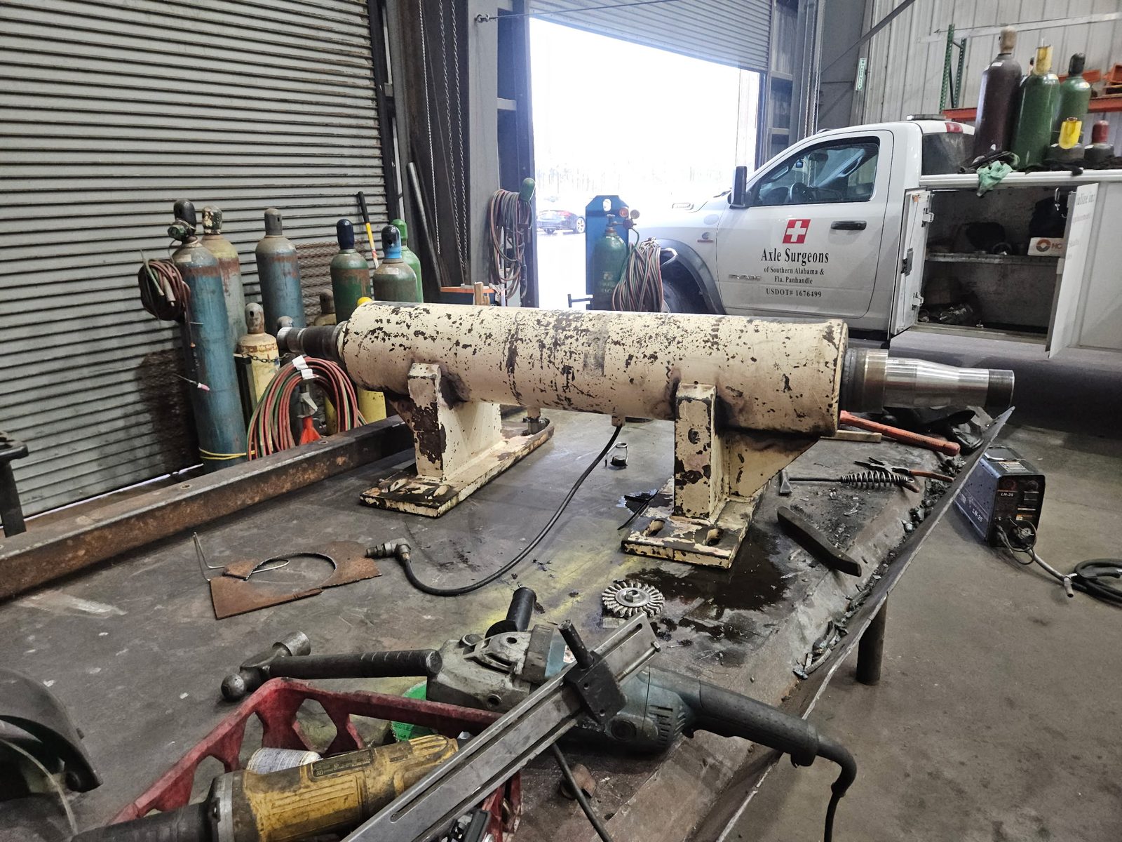 Paper mill debarking machine roller at the Axle Surgeons shop for spindle repair
