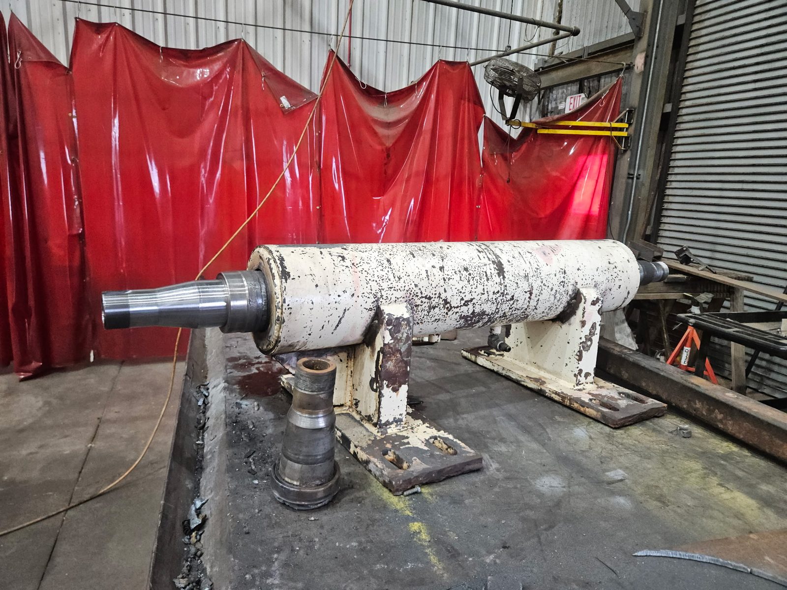 Paper mill debarking machine roller with the repaired spindle assembly fitted