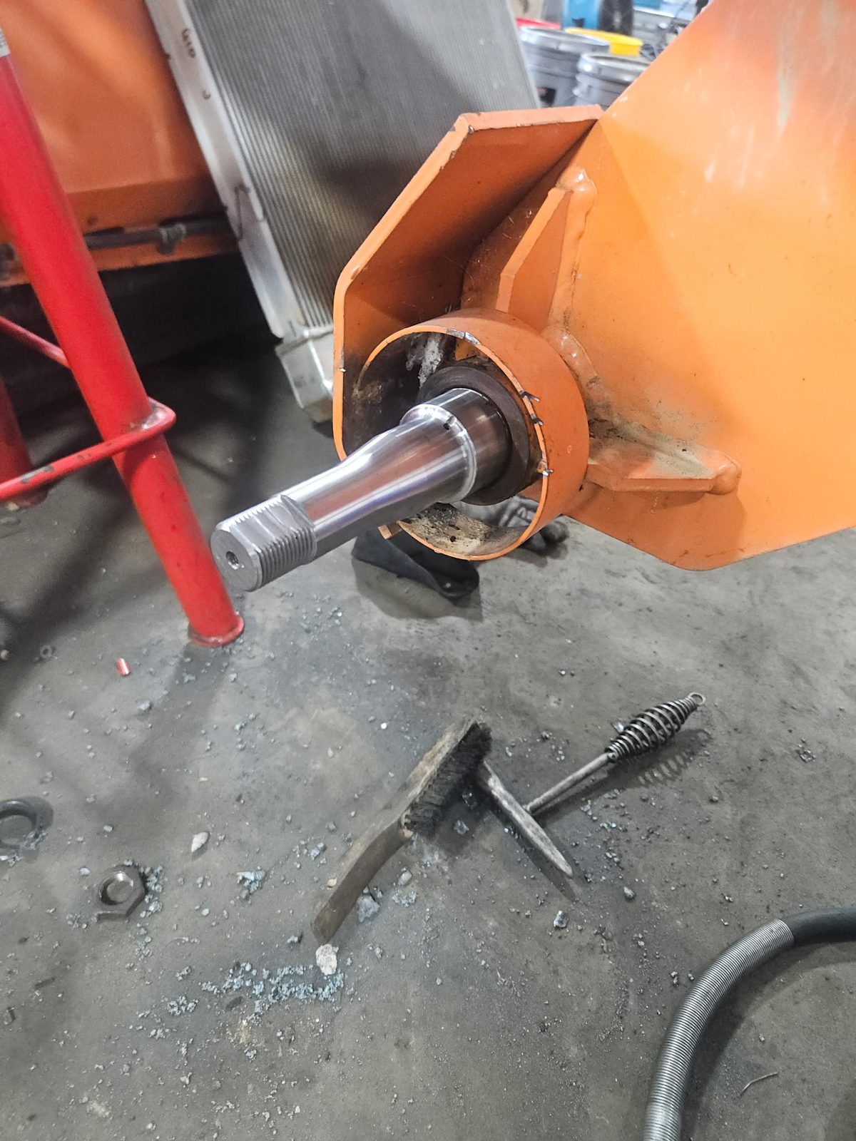New replacement spindle installed on a SweepMaster 300 street sweeper