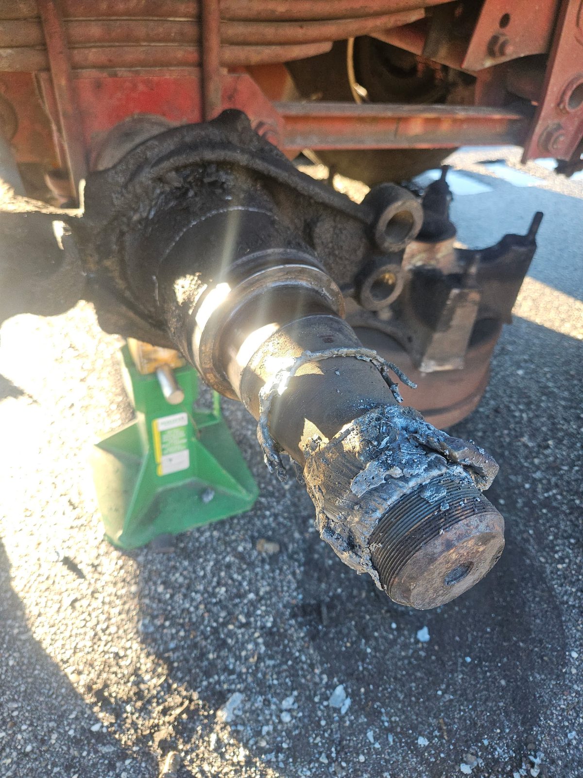 Worn trailer axle spindle before replacement