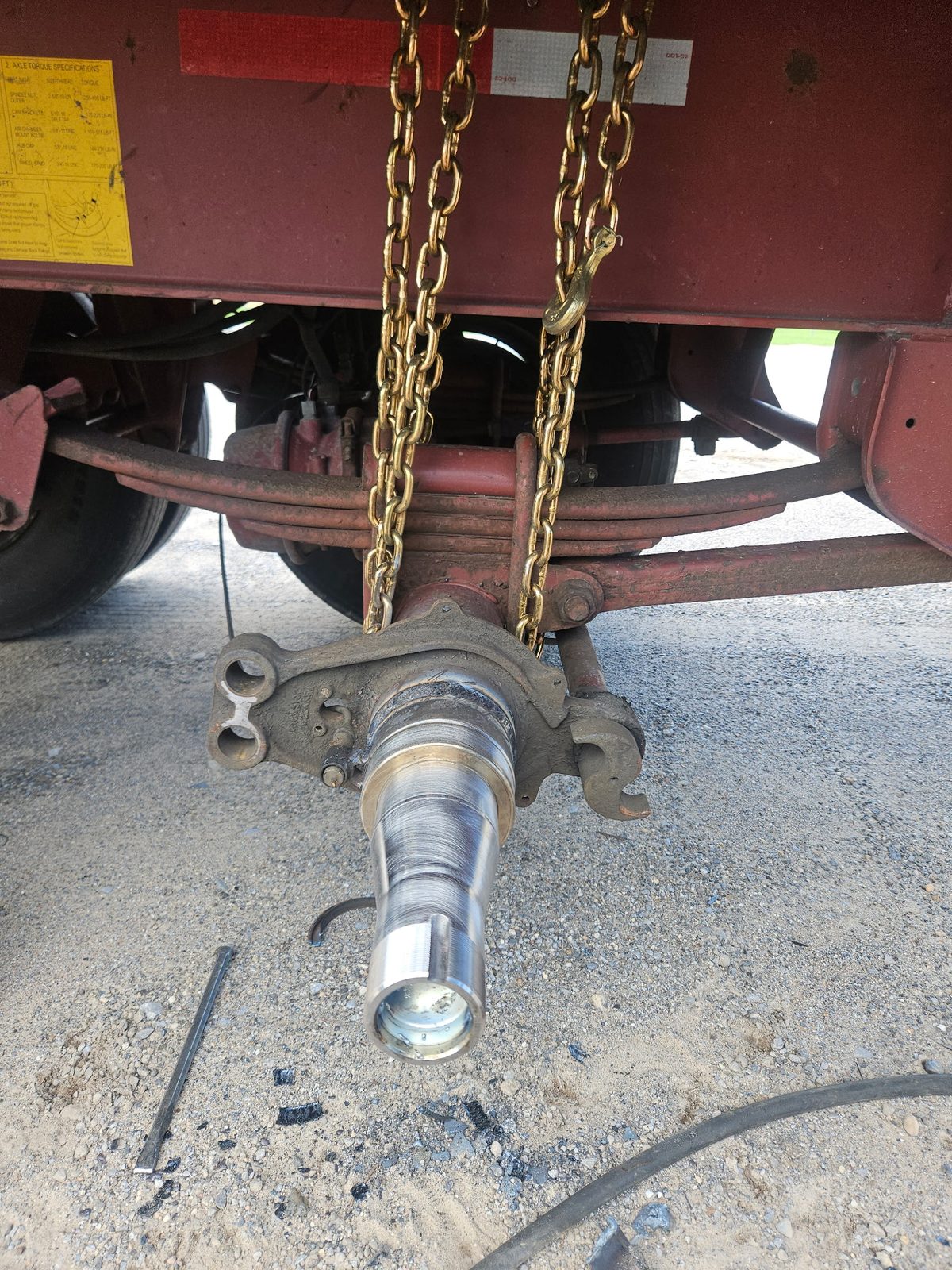 Replacement trailer axle spindle fitted to the axle end