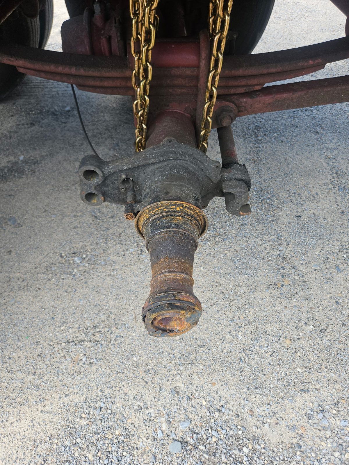 Corroded trailer axle spindle before replacement