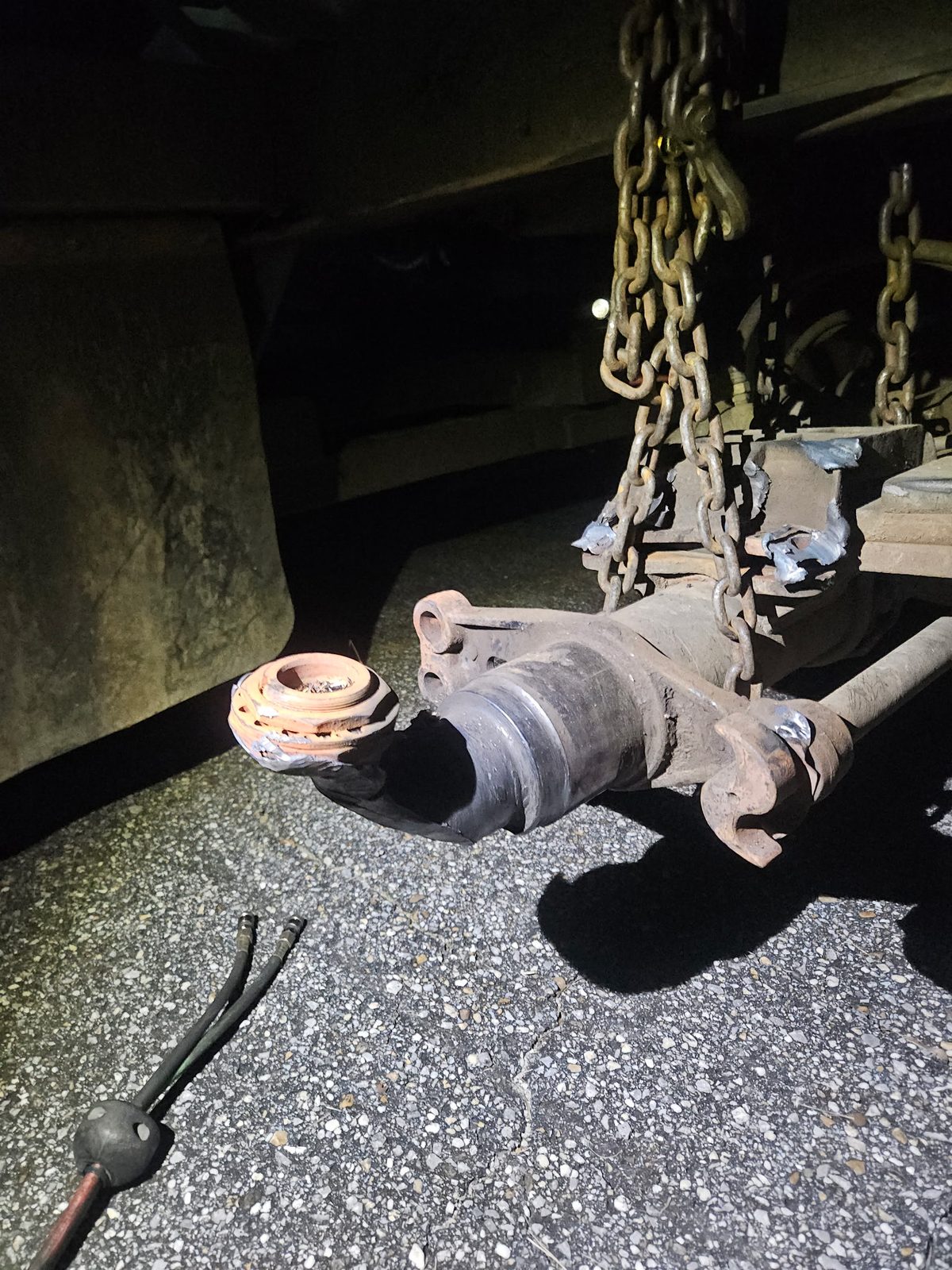 Damaged trailer axle spindle before replacement
