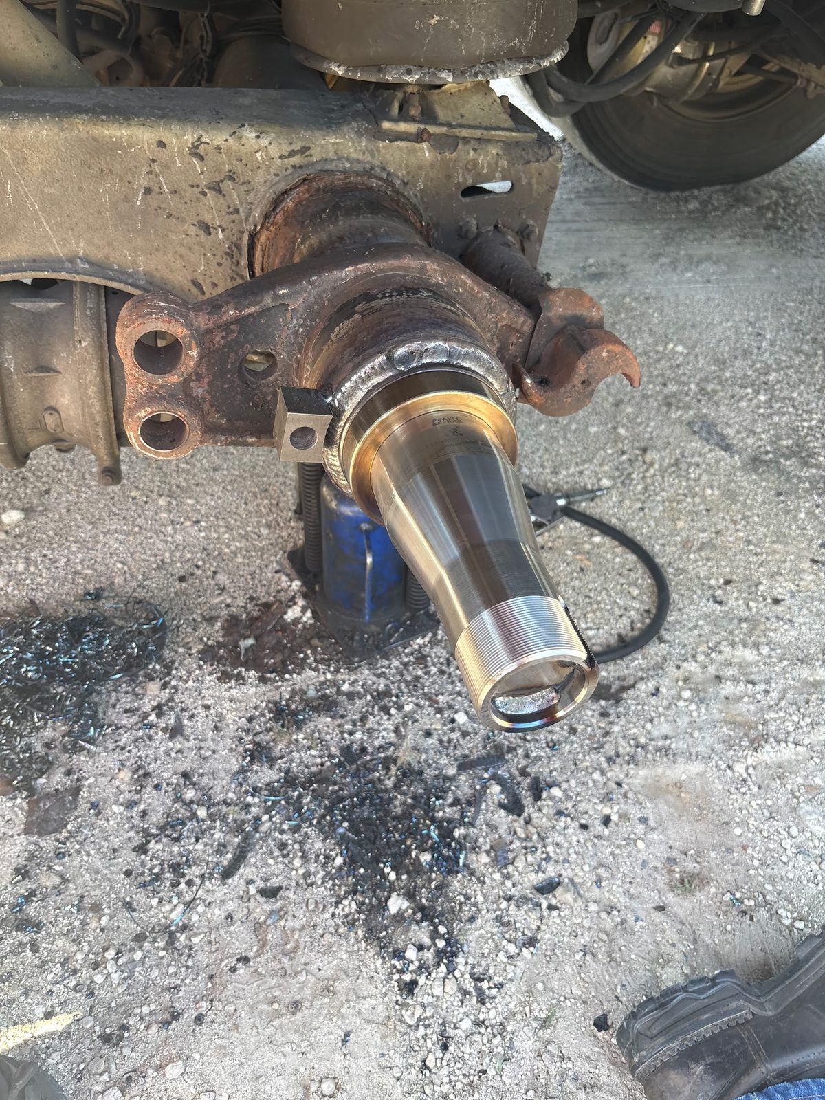 New trailer axle spindle installed on the trailer axle